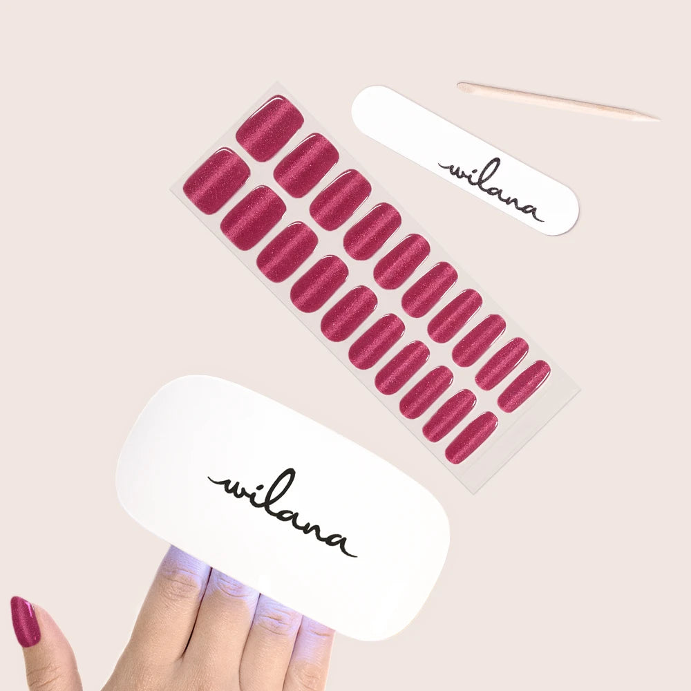 Set of red nail wraps with 'wilana' branding on a beige background