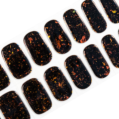 Semi-cured gel nail stickers with a black and orange brocade glitter design